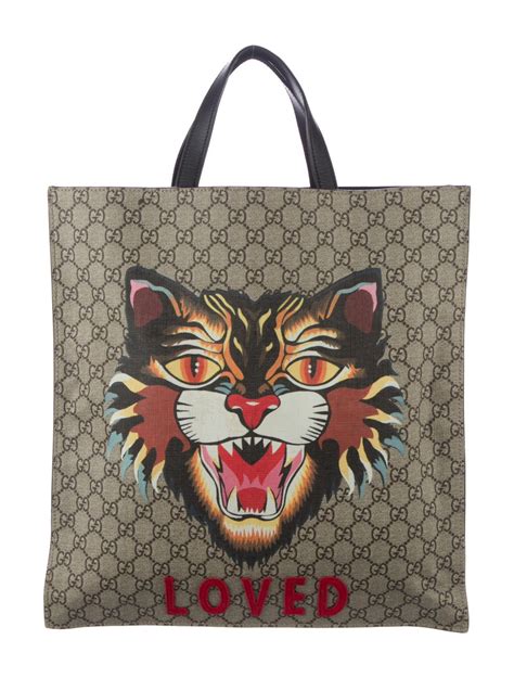 gucci cat carrier|Gucci tote with cat.